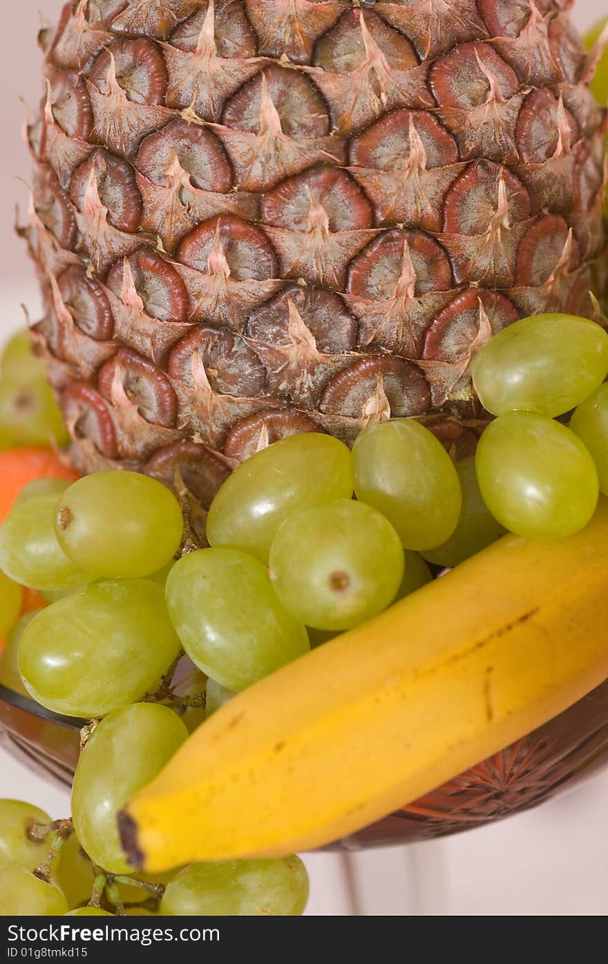 Fruit in a glass vase.