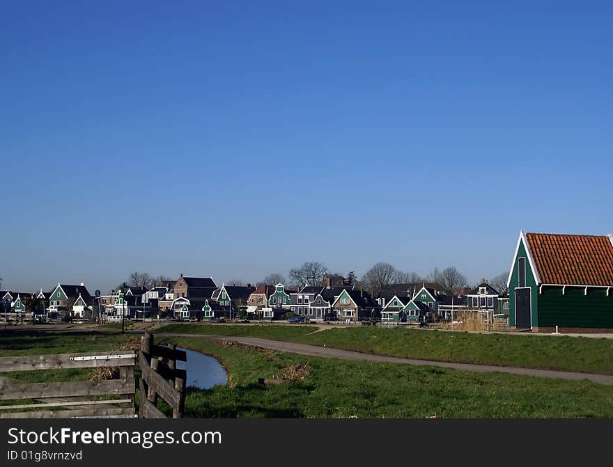 Fence And View With Typical  Dutch Zaanse Houses