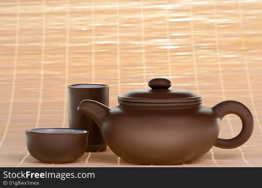 Brown chinese ceramic teapot with cups. Brown chinese ceramic teapot with cups