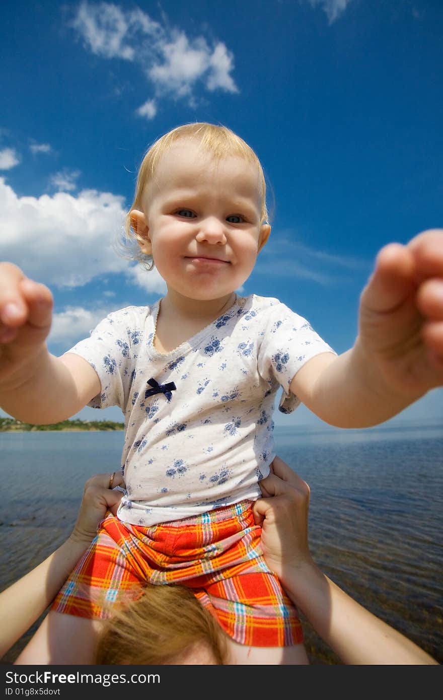 Happy child and blue sky. Happy child and blue sky