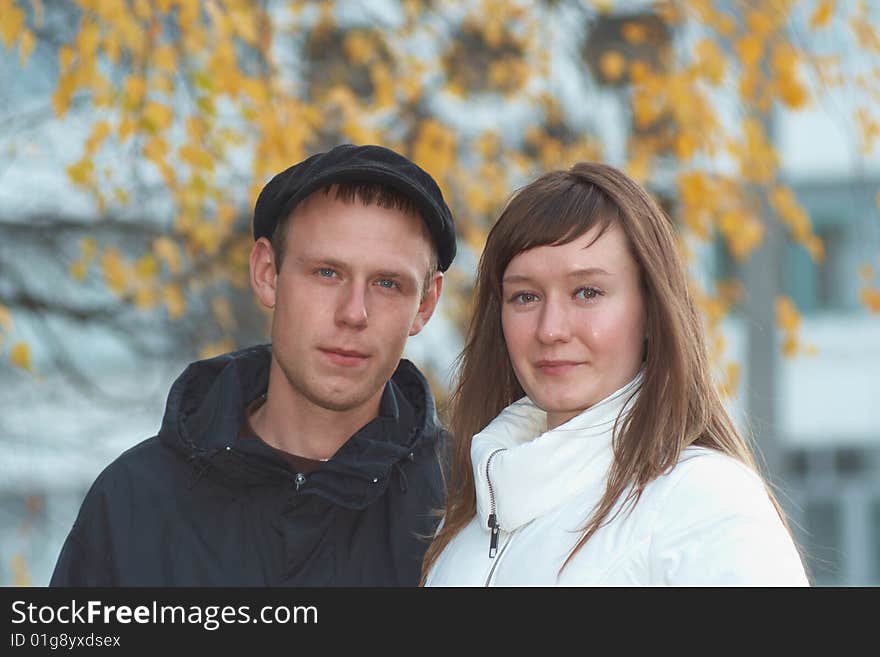 Young man and  young woman on the white background. Young man and  young woman on the white background