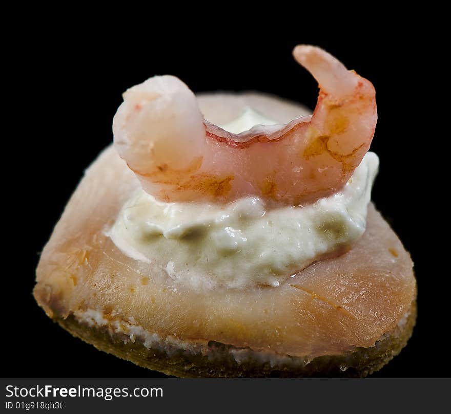 Shrimp on a small bread with cream. Shrimp on a small bread with cream