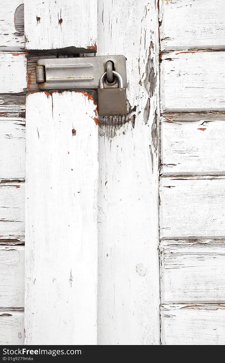 Padlock on an old white wooden gateway. Padlock on an old white wooden gateway