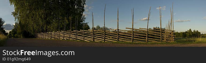 Sunset on wooden fence in the country side