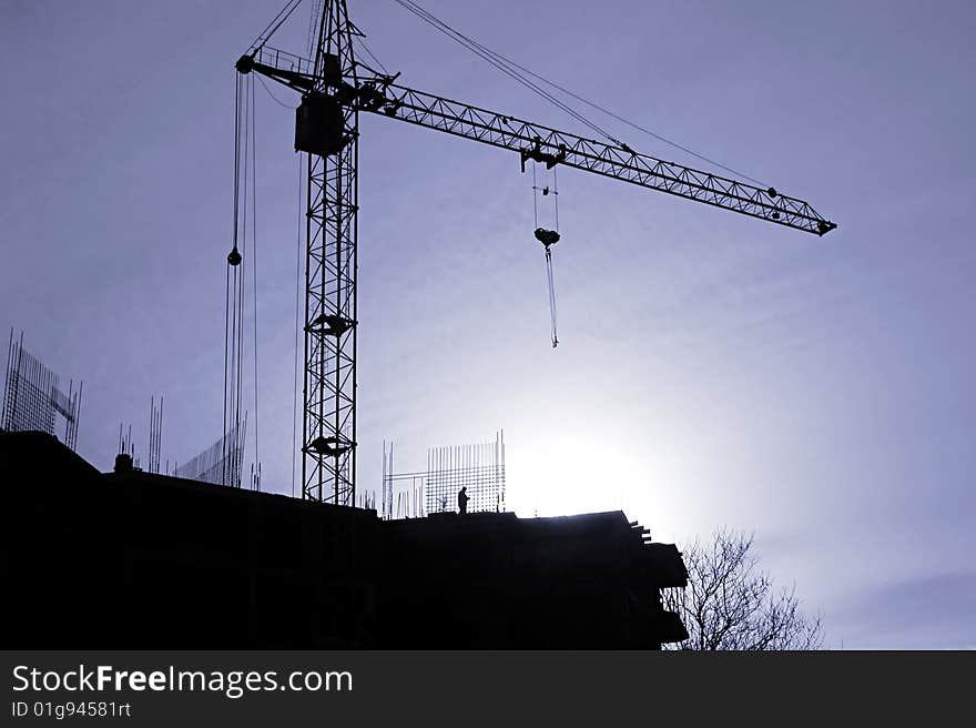 Сonstruction activity. Silhouette of construction worker