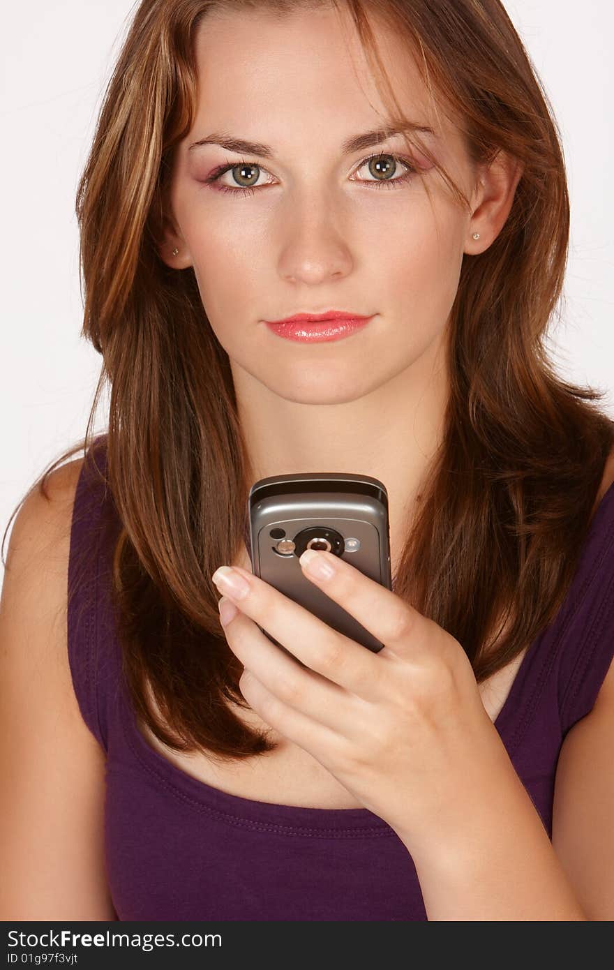 Brunette with mobile cellphone in hand looking up