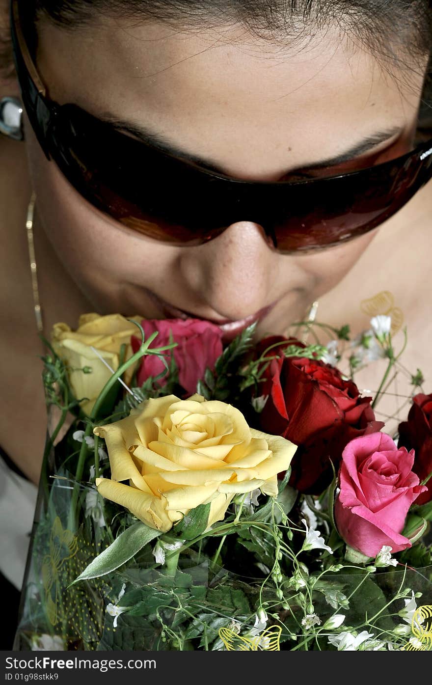 Girl with roses in studio.