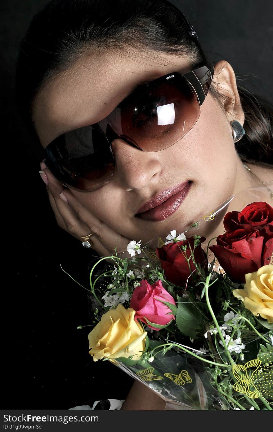 Indian girl with colored roses. Indian girl with colored roses.