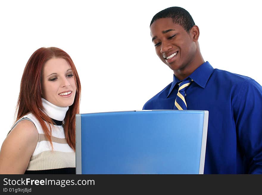 Smiling interracial couple with a laptop over white. Smiling interracial couple with a laptop over white.