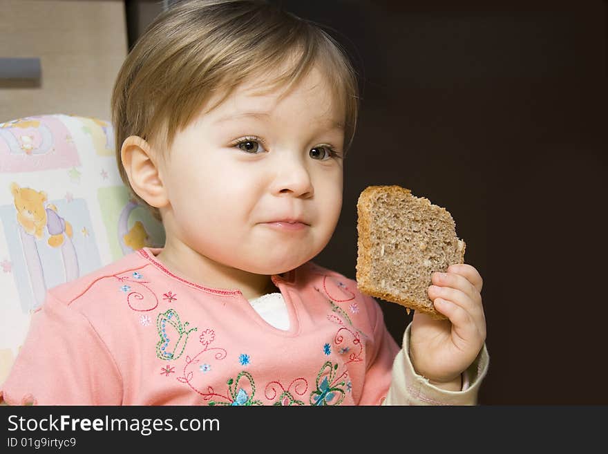 Sweet toddler baby girl eating. Sweet toddler baby girl eating