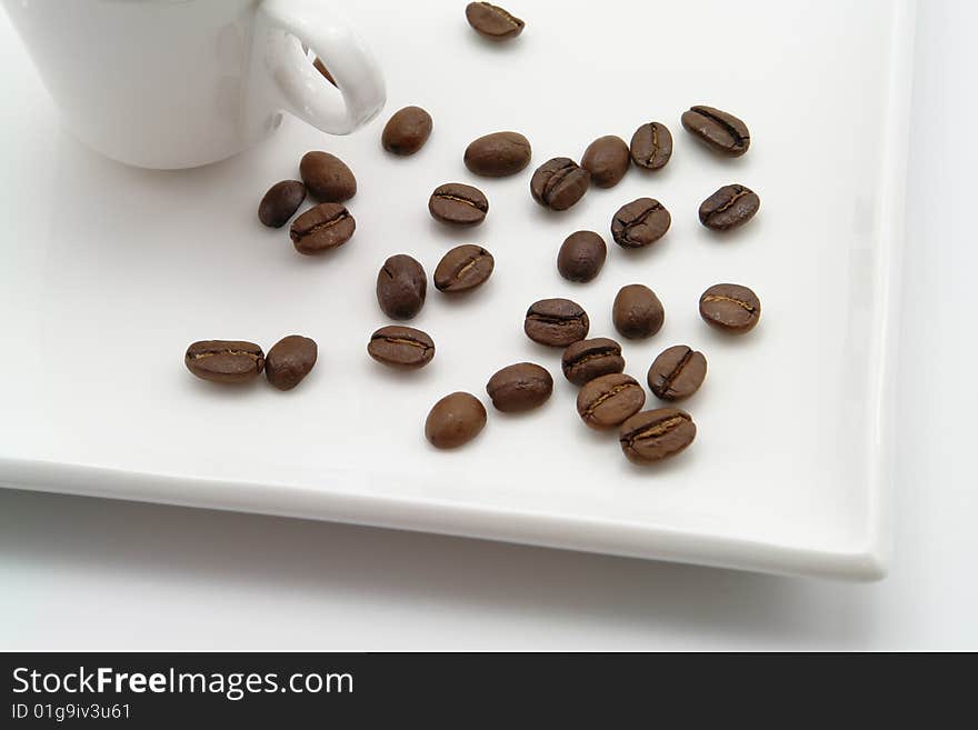 Aroma bean coffee and cup on a white background