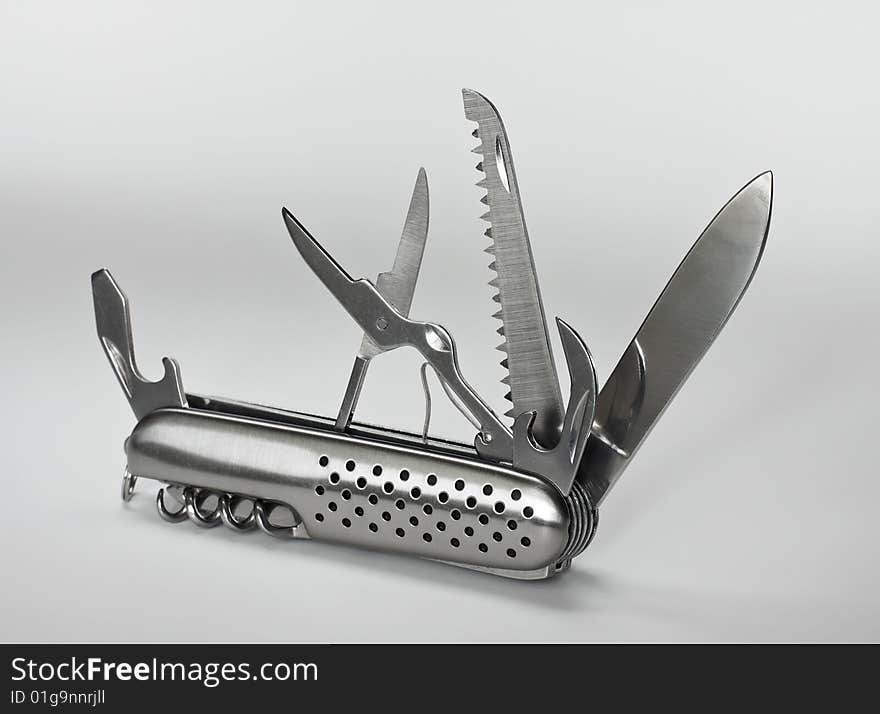 Multitool Penknife on the gray background