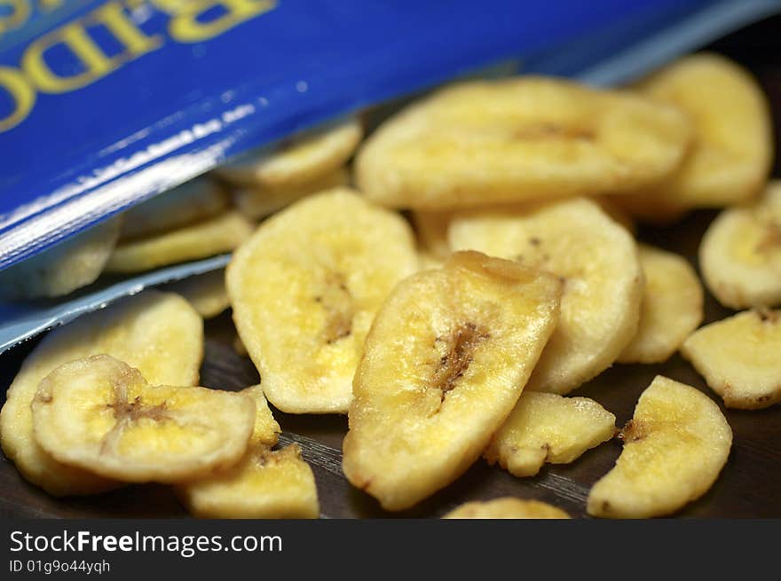 Staying on a diet is tough. Why not snack on a healthy alternative to potato chips. Closeup shot of banana chips. Staying on a diet is tough. Why not snack on a healthy alternative to potato chips. Closeup shot of banana chips.