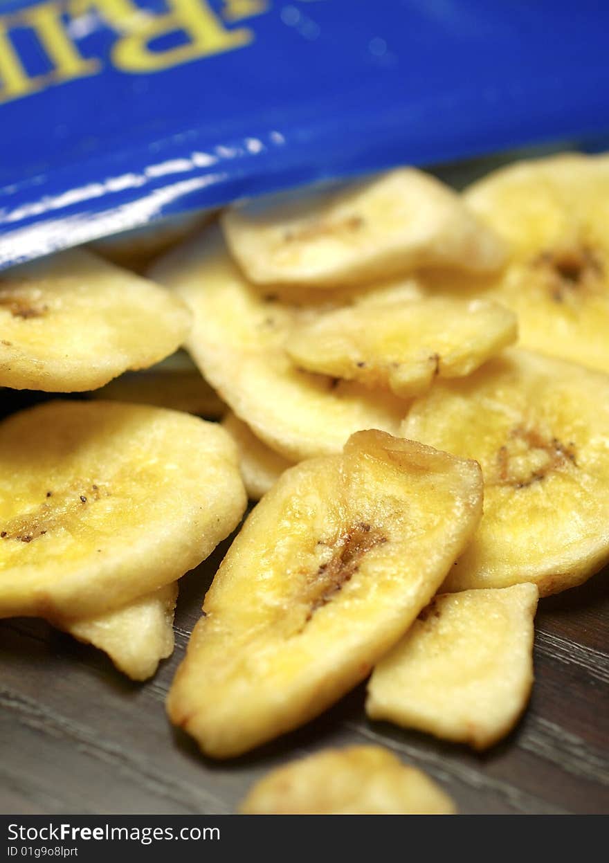 Staying on a diet is tough. Why not snack on a healthy alternative to potato chips. Closeup shot of banana chips. Staying on a diet is tough. Why not snack on a healthy alternative to potato chips. Closeup shot of banana chips.