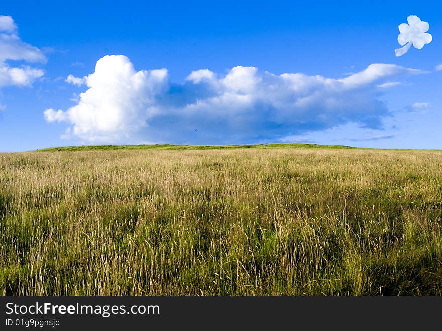 Rural landscape with a blue sky and a shamrock cloud. Ireland. Rural landscape with a blue sky and a shamrock cloud. Ireland