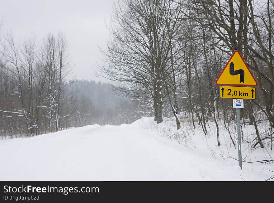 Icy winter road in forest