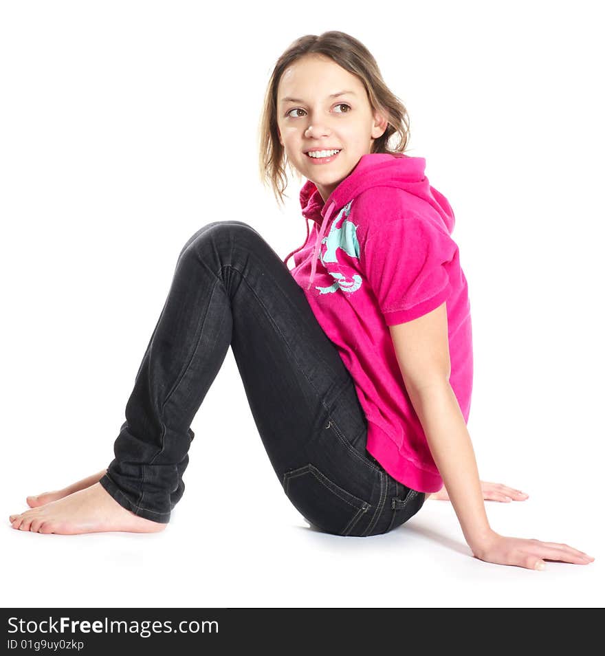 Smiling stratching tennage girl on white background