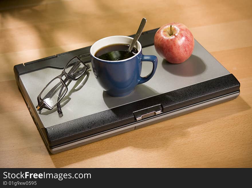 Glasses on top of laptop computer