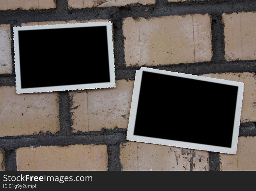 Photoframe of an empty photo on the brick wall. Photoframe of an empty photo on the brick wall