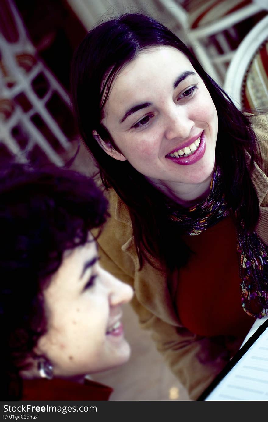 Portrait with color effect of a two young woman smiling. Portrait with color effect of a two young woman smiling