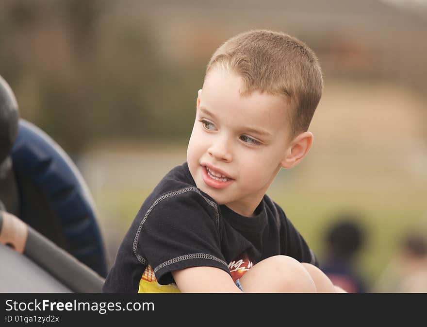 Adorable Child Having Fun Playing at the Playground. Adorable Child Having Fun Playing at the Playground