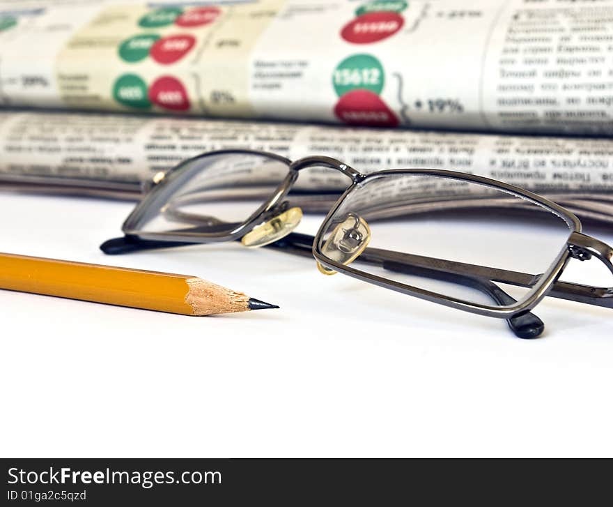 Newspaper and glasses isolated on white background. Newspaper and glasses isolated on white background