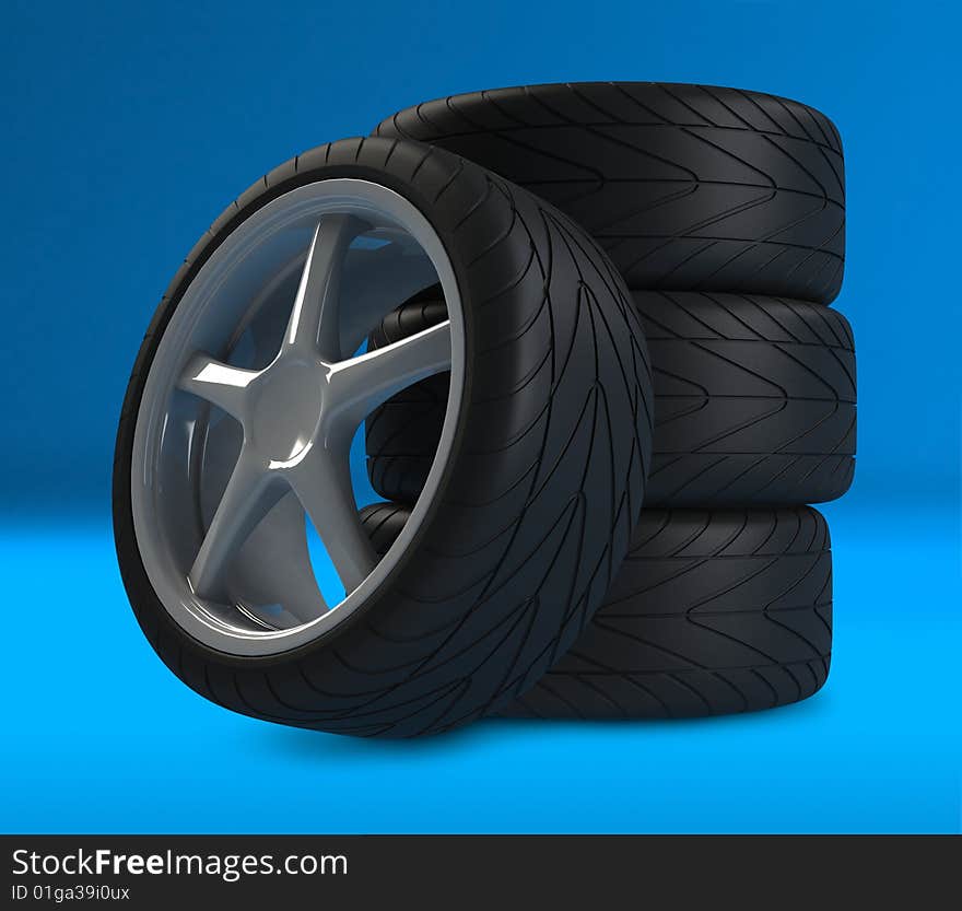 Heap of wheels with aluminium rims over the blue background