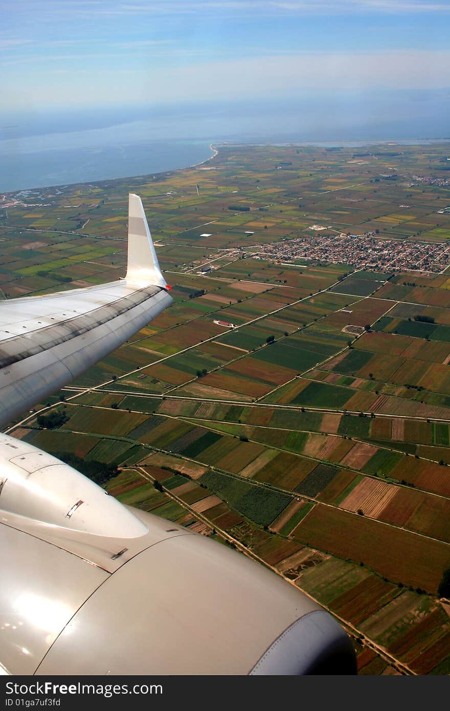 Plane above Greek landscape