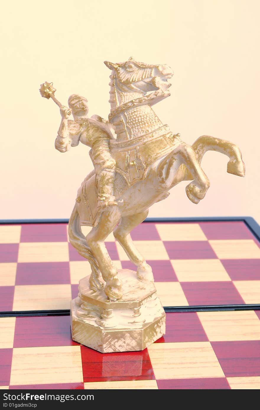 The chess horse has prepared for attack and has lifted a mace. The chess horse has prepared for attack and has lifted a mace.