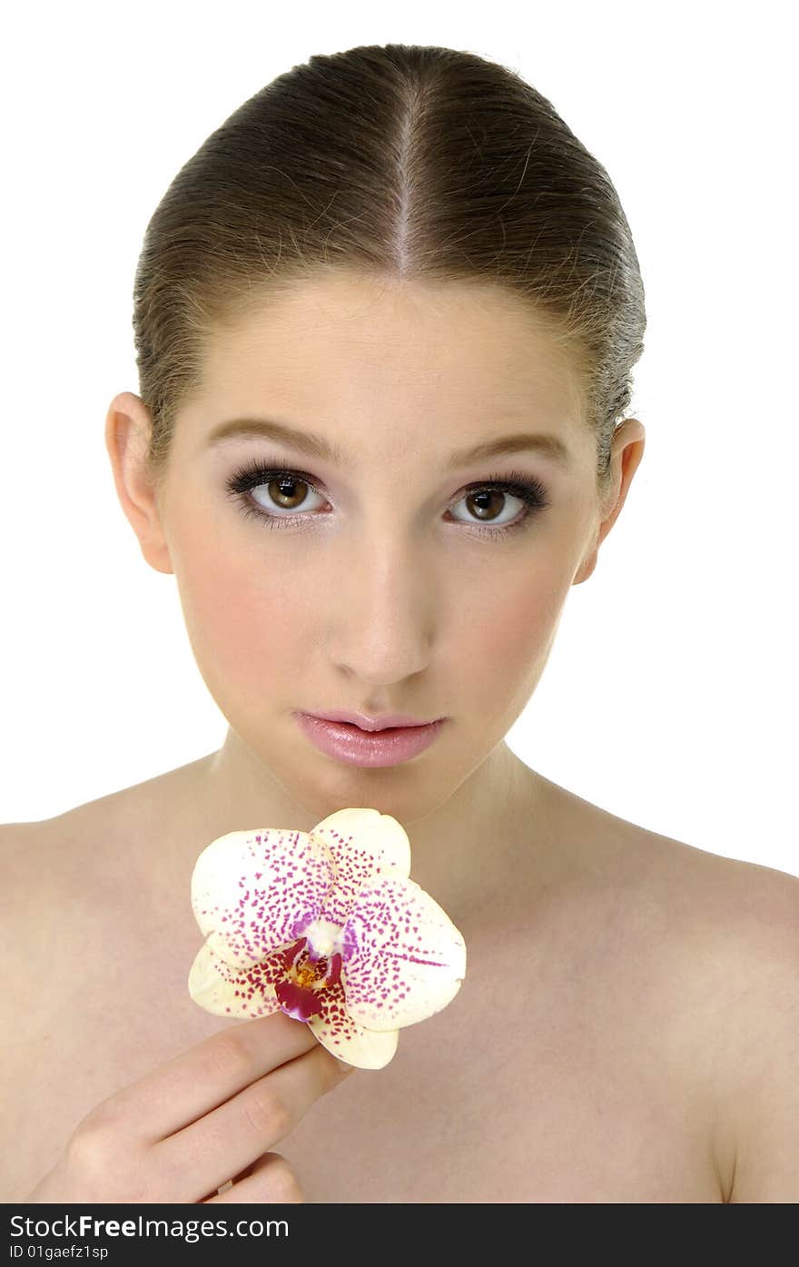 Closeup portrait of a beautiful girl with orchid. Closeup portrait of a beautiful girl with orchid