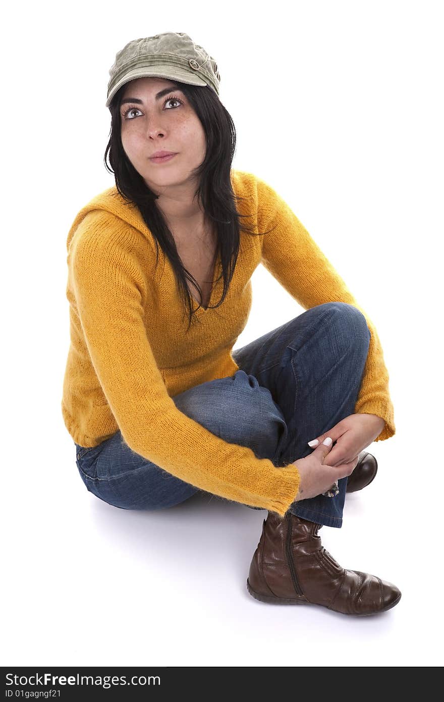 Young casual woman with hat and yellow sweater