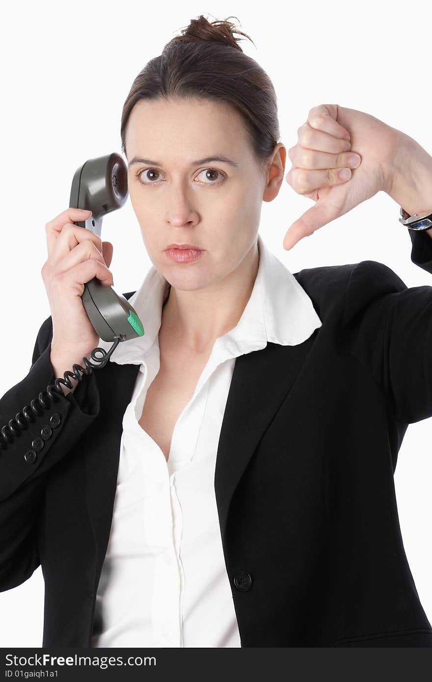 A woman in a business role indicating bad news with her thumb down. A woman in a business role indicating bad news with her thumb down.