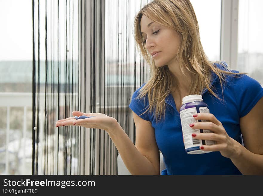 Woman taking a pill