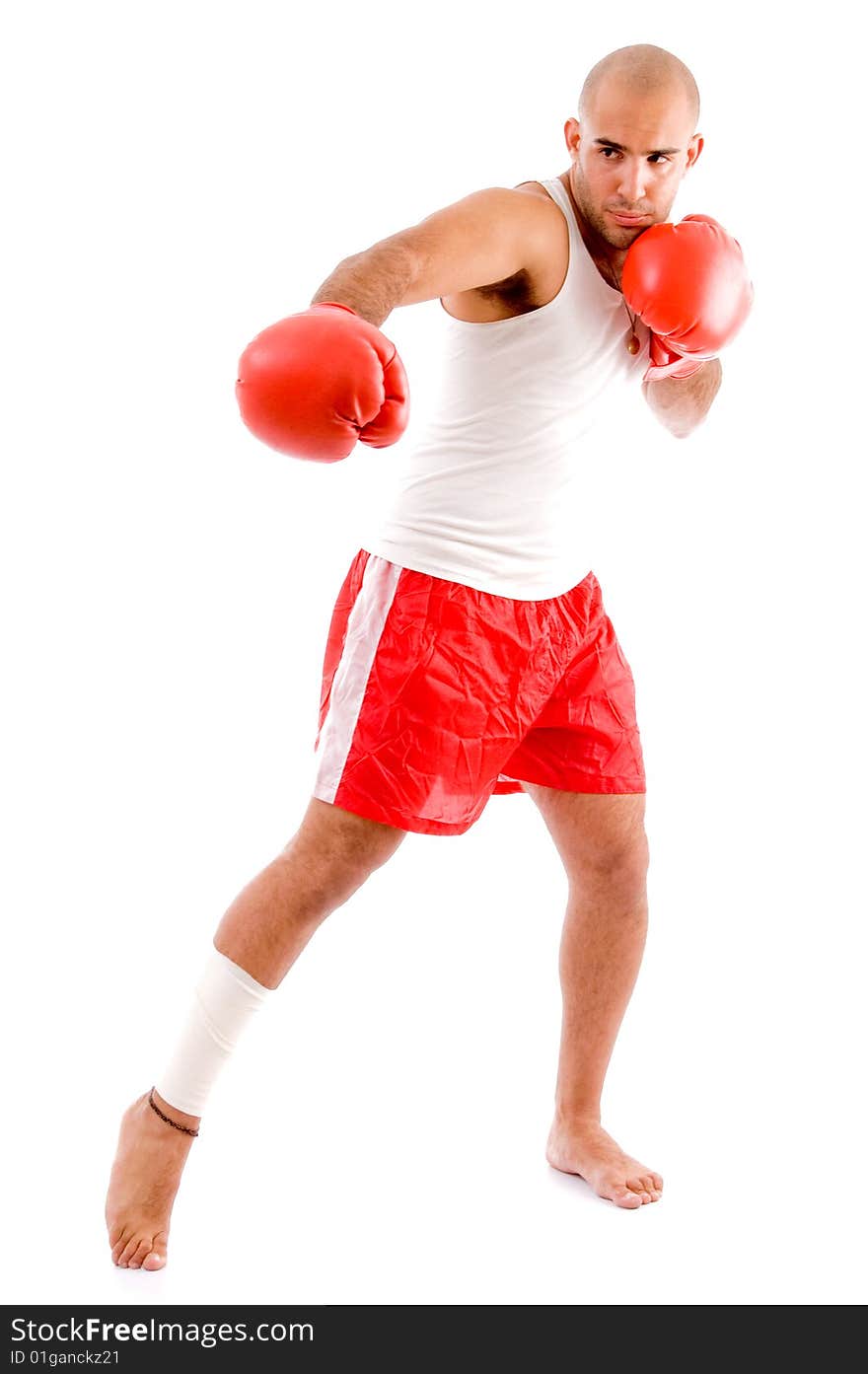 Muscular man in punching pose