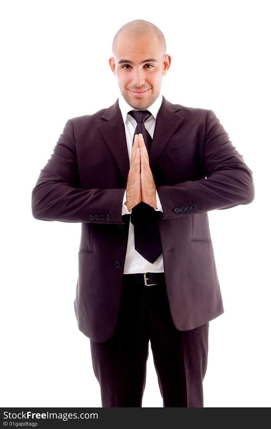 Businessman standing joining both hands against white background