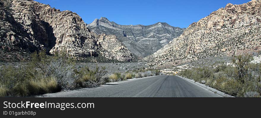 A Lone Stretch of Highway Winding Through the Desert. A Lone Stretch of Highway Winding Through the Desert