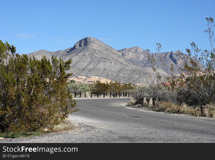 A Lone Stretch of Highway Winding Through the Desert. A Lone Stretch of Highway Winding Through the Desert