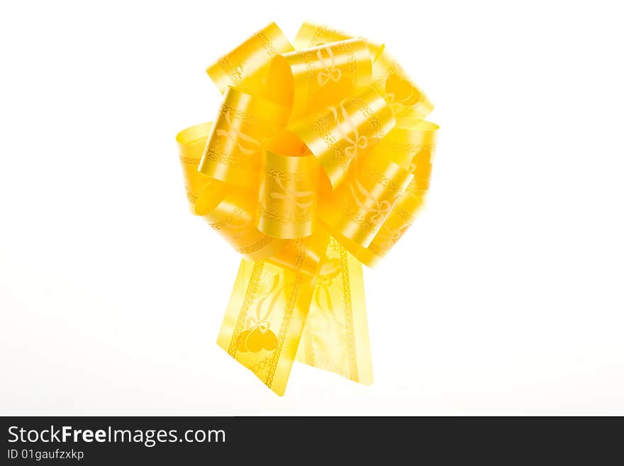 Yellow bow on a white background