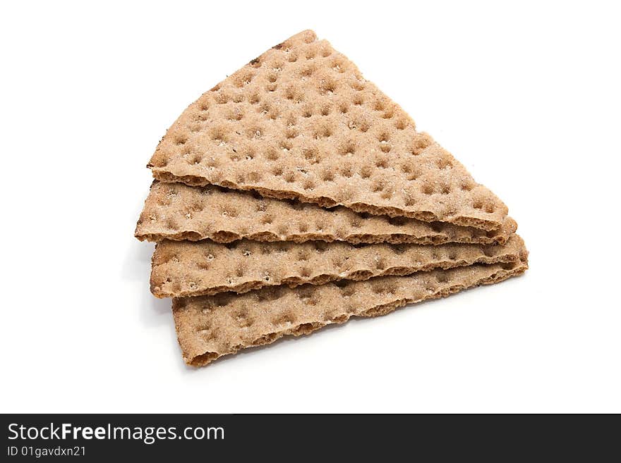 Four slices of healthy cereal crisp bread on white background