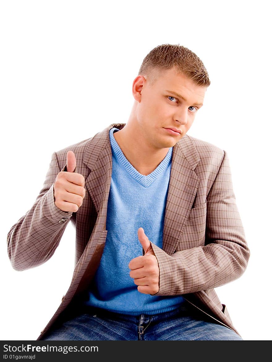 Handsome male showing thumbs up on an isolated white background