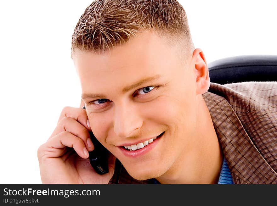 Close up of handsome man talking on mobile on an isolated white background. Close up of handsome man talking on mobile on an isolated white background