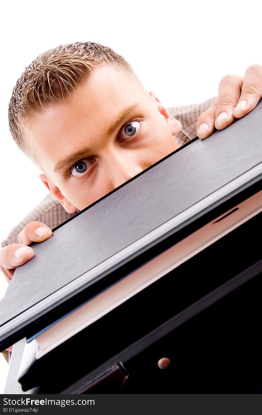 Close up of professional man peeping from files on an isolated background