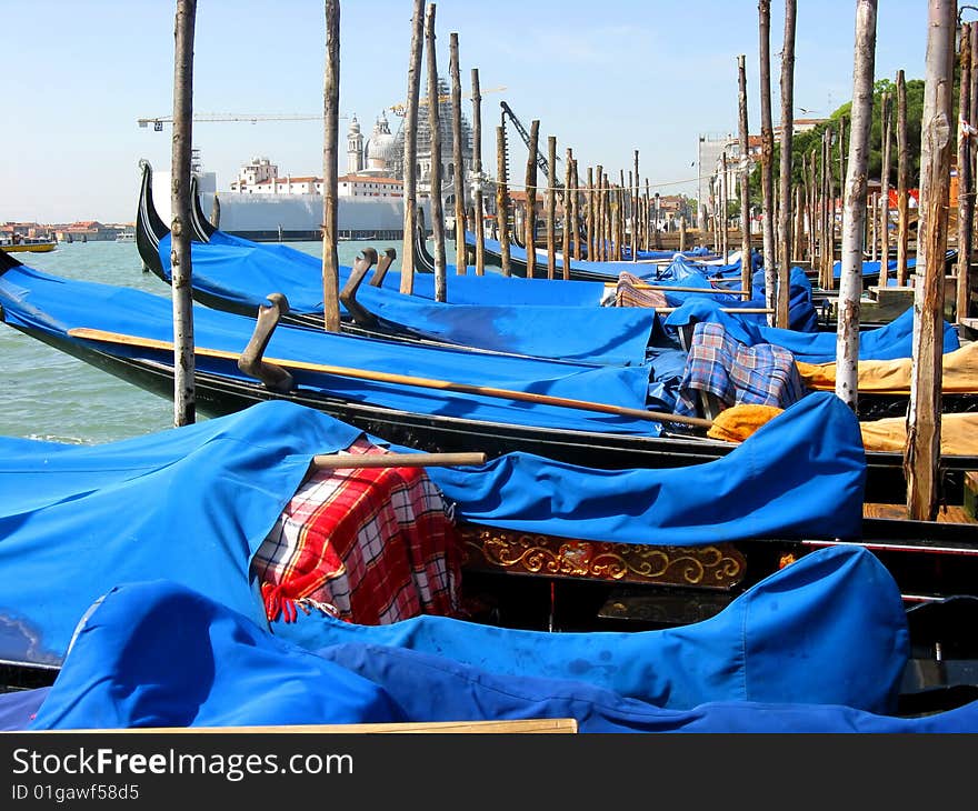 Gondolas moored at the grand canal at Venice Italy. Gondolas moored at the grand canal at Venice Italy