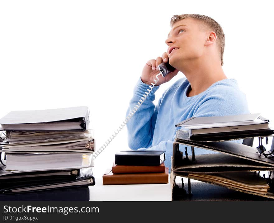 Side view of young professional with phone  in an office