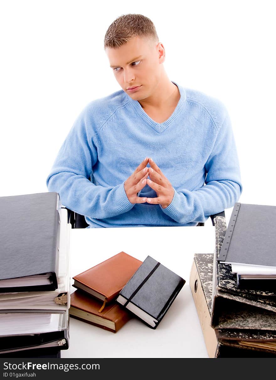 Sitting young professional looking aside in an office. Sitting young professional looking aside in an office