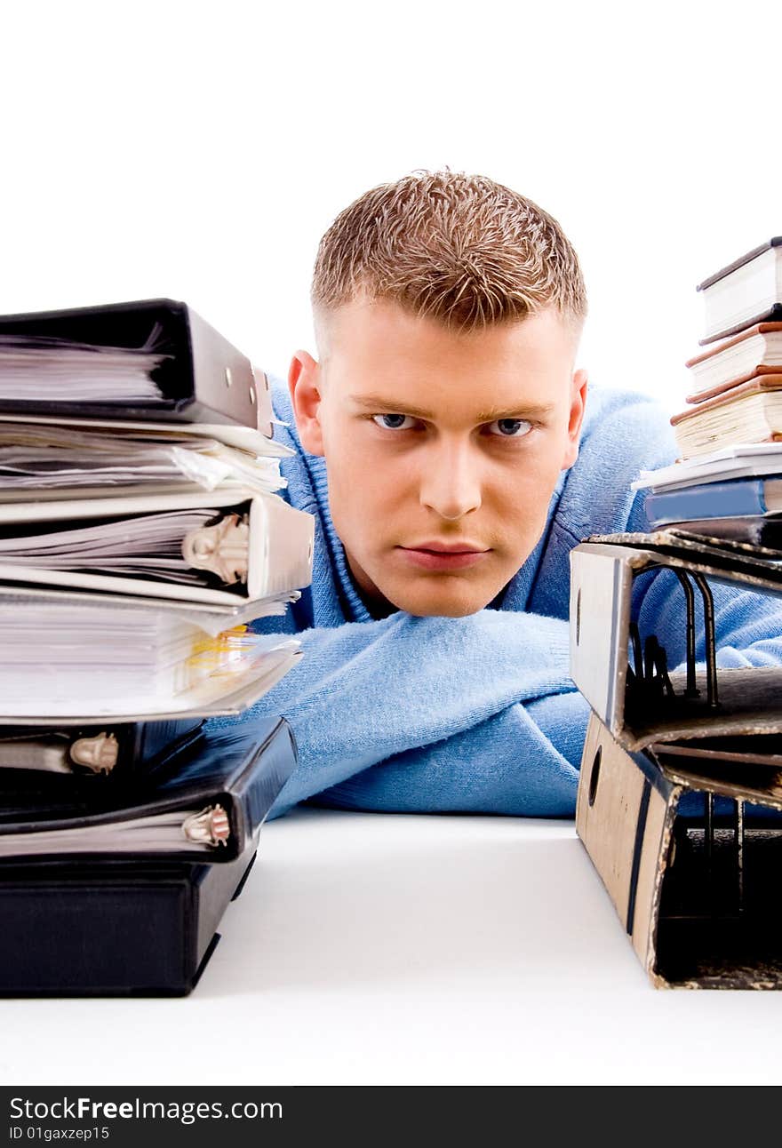 Young professional looking between files in an office