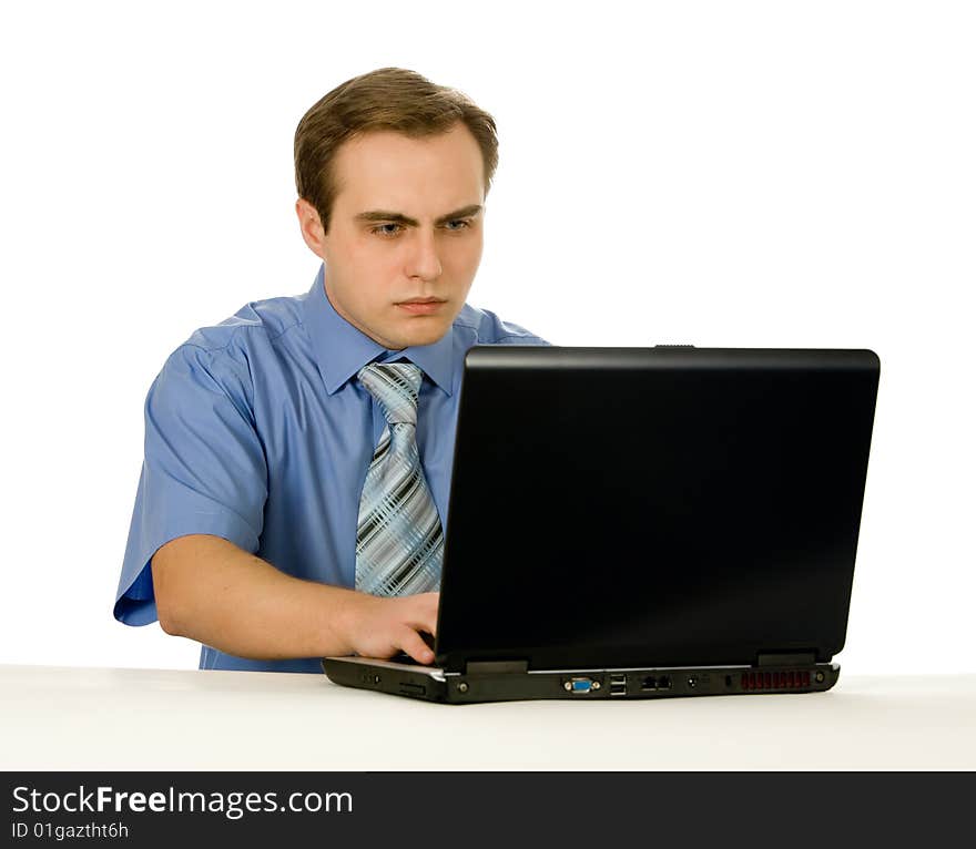 Businessman working on laptop. Isolated on white.