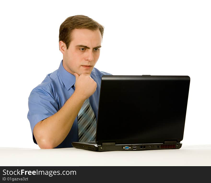 Businessman working on laptop. Isolated on white.