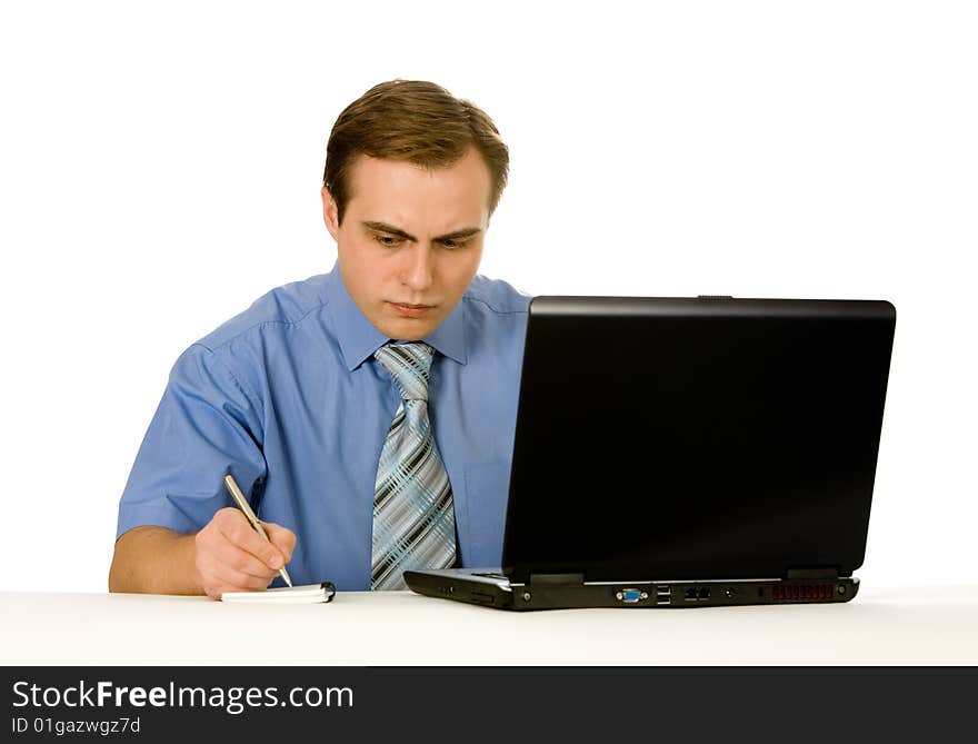 Businessman working on laptop. Isolated on white.