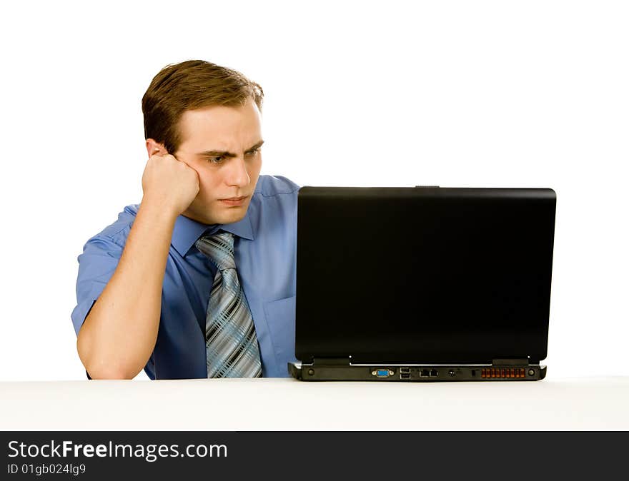 Businessman working on laptop. Isolated on white.